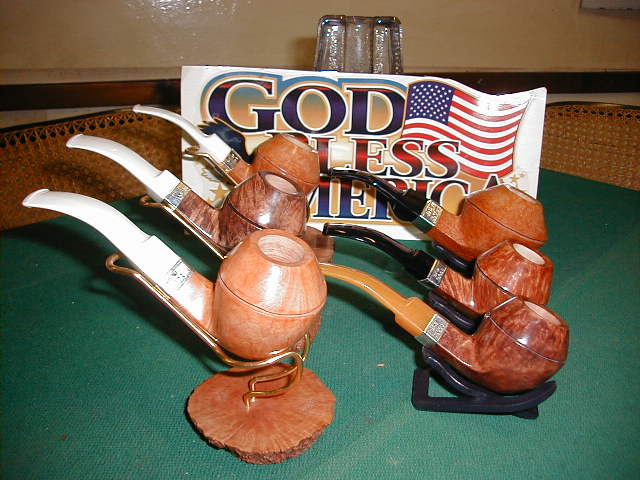 These are the pipes in 015 shape rhodesian curved with sterling band printed
on DWT2003...